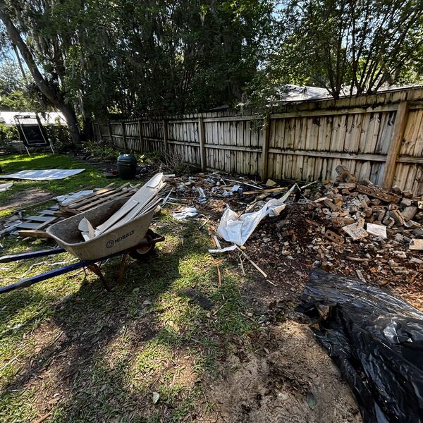 Backyard fence and yard debris removal